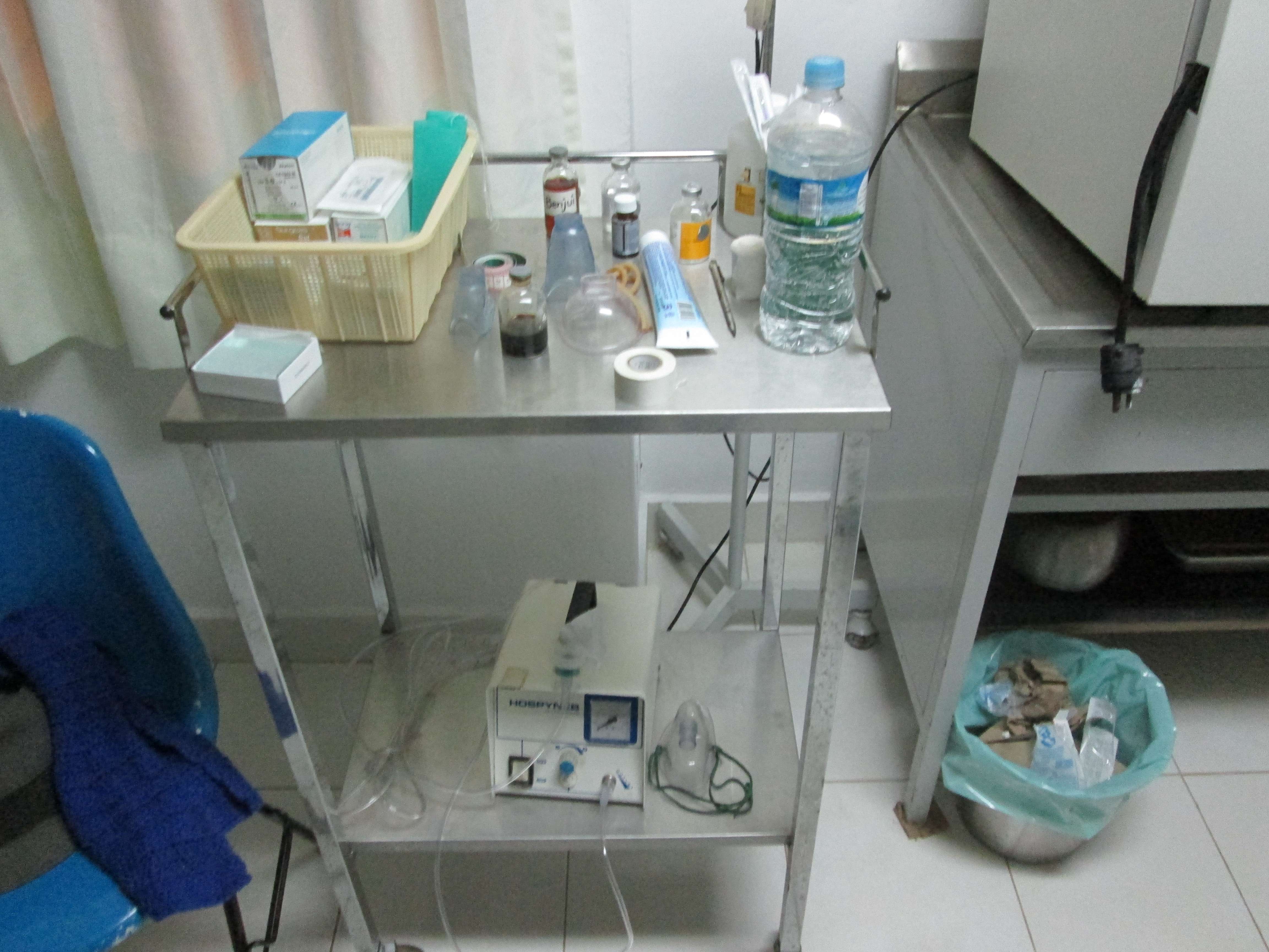 Rolling table with various medicines and medical instruments