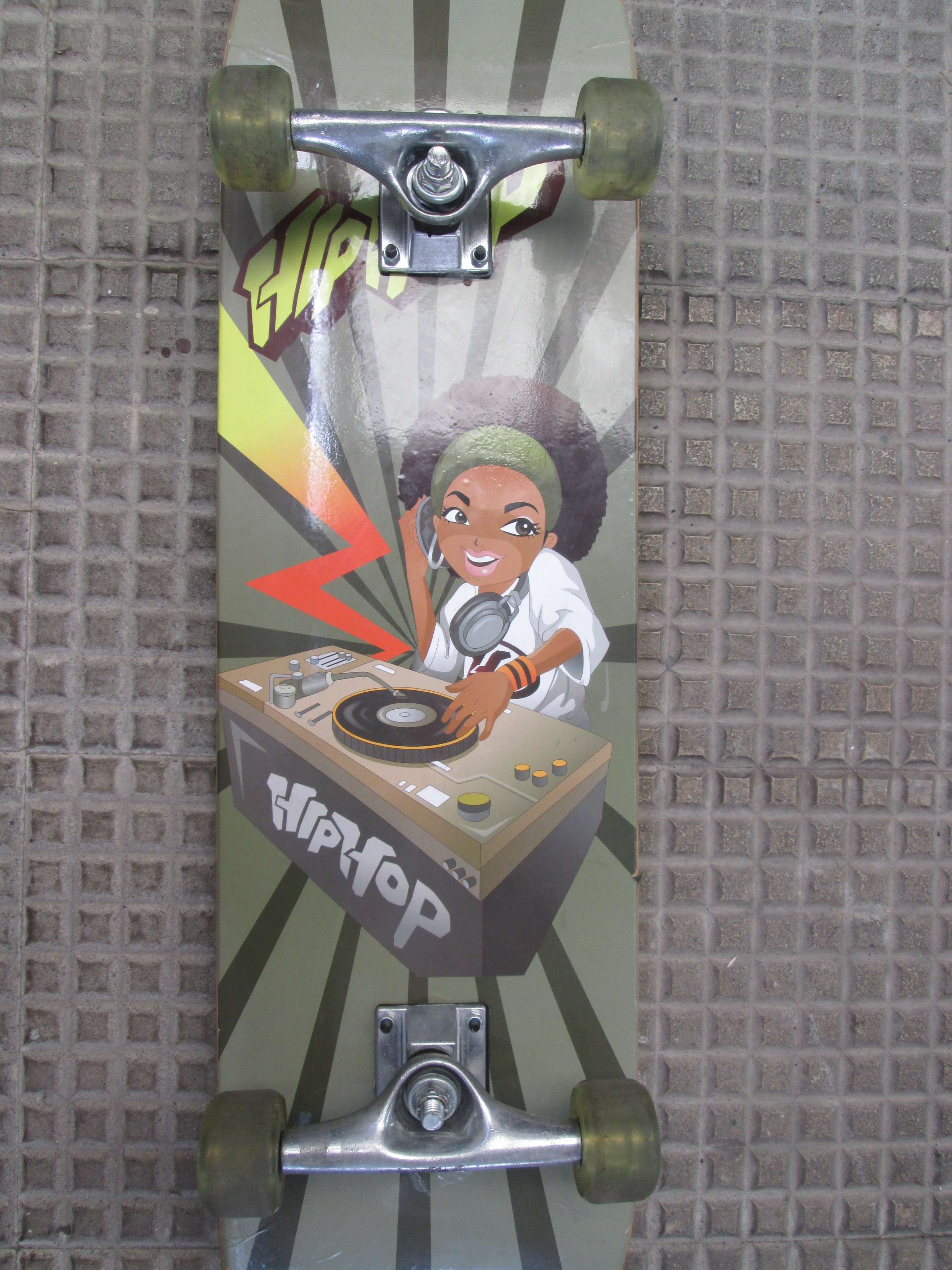 The skateboard I bought, with the image of an animated DJ on the deck